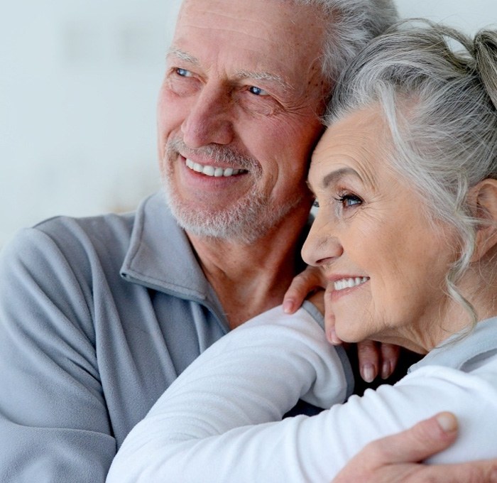 Older man and woman with healthy smiles thanks to the dentist in York Pennsylvania