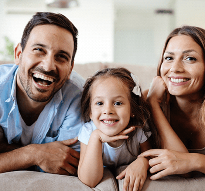 Happy family after visiting dentist for checkups and cleanings in York