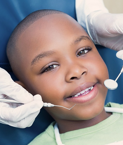 Child receiving fluoride treatment