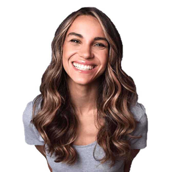 Woman showing attractive smile with dental crowns in York
