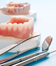 Dental tools lying next to full dentures in York