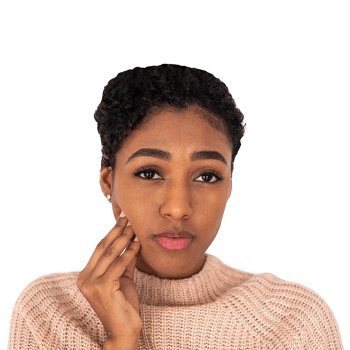 Woman with a toothache in York touching her cheek