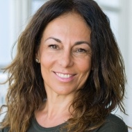 Woman smiling after dental visit with sedation dentistry