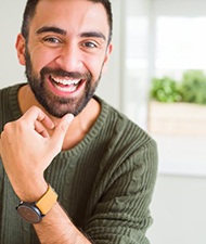 a man smiling after restoring his smile