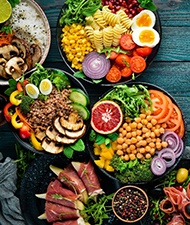 Variety of colorful, healthy foods arranged on tabletop