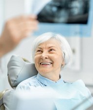 patient smiling during implant consultation