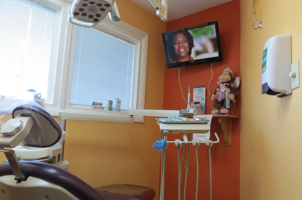 T V screen on wall of dental treatment room