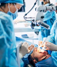 Dental team performing oral surgery