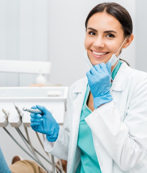 Dentist smiling at patient's dental exam