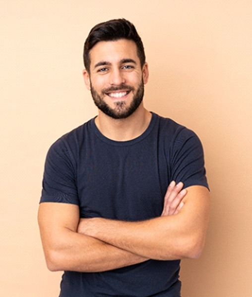 Handsome man enjoying benefits of implant-retained tooth replacement