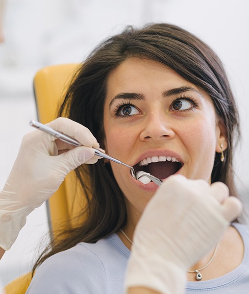 Woman receiving root canal treatment