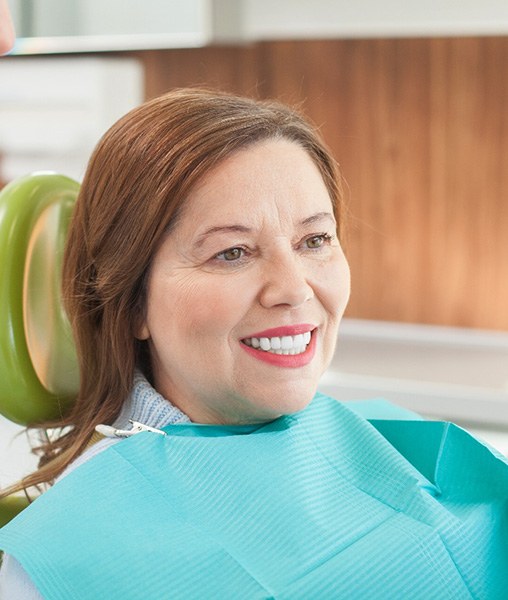 Woman smiling in the dental chair
