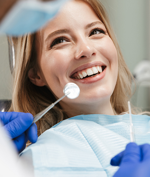 Woman in dental office for teeth whitening treatment