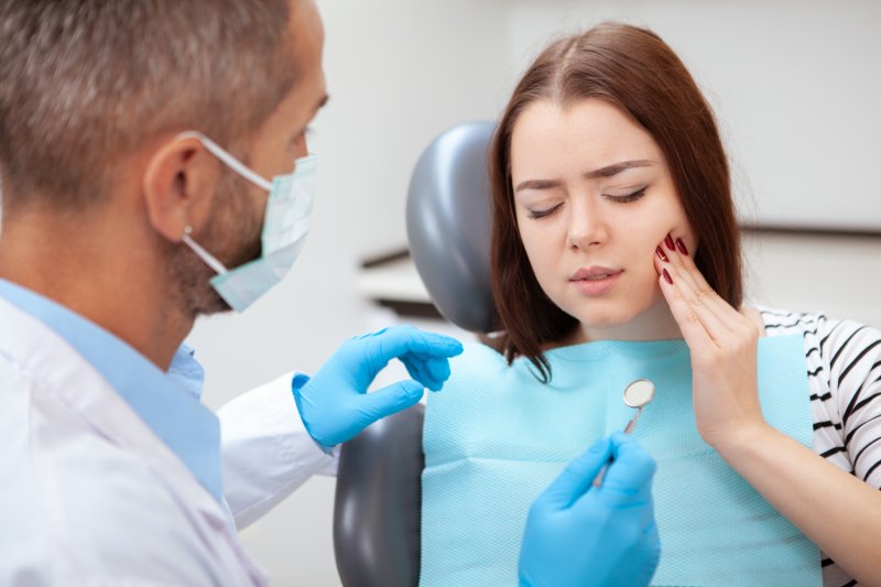 woman with dental emergency