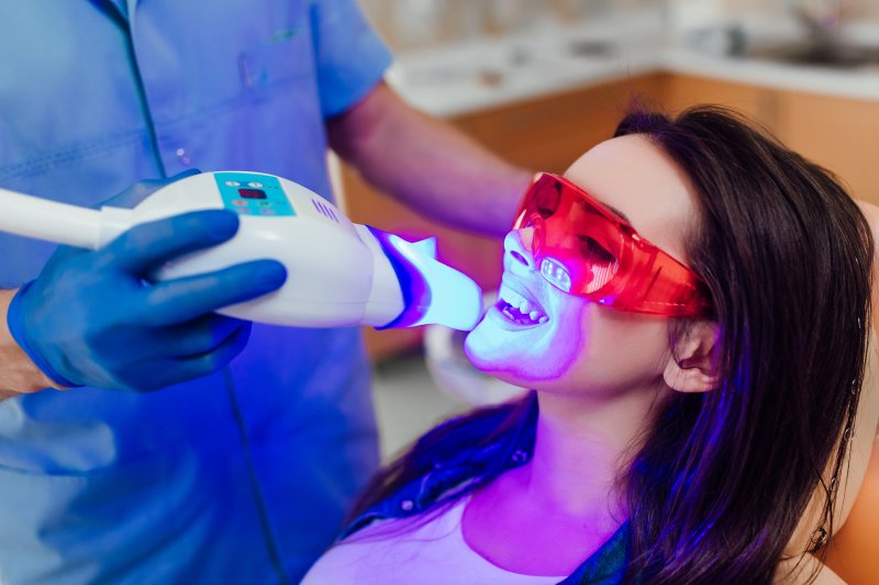 A woman getting her teeth professionally whitened